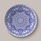 Round blue floral ornament Chinese style painting on porcelain. Pattern shown on the ceramic platter.