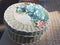 Round blue handicraft paper box decorated with roses