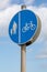 Round blue sign indicating lane markings for cyclists and pedestrians new brighton wirral august 2019