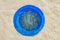 Round blue window and bar with arabic pattern . Wall of a house in Sidi Bou Said, Tunisia