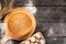 round bran bread on a wooden background, top view.