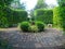 Round brick path in English garden