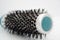 Round brush with coiled hair. Hair loss