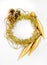 Round circle of tinsel, christmas long toy, three bumps, chain of balls, beads. New year decorations of yellow and golden color