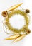 Round circle tinsel, christmas long toys, bumps, chain of balls, beads. New year decorations of yellow and golden color on a white