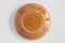 Round clay probe with orange glossy glaze