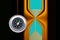 Round compass on abstract hourglass background