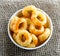 Round corn on wooden background