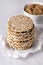 Round Crisp Healthy Gluten Free Buckwheat Crispbread on Light Gray Background Vertical