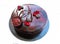 Round dark marbled cake with flower petals and chocolate decorations