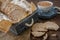 Round dietary loaves of airy buckwheat  in vintage box and a cup of raw buckwheat on wooden background