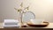 a round dish adorned with a white towel, cotton pads, a wooden brush, and a glass vase with a tree branch, an inviting