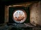 Round door or gate to abandoned nuclear rector or generator room in ruined and destroyed Crimean Nuclear Power Plant