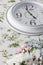 Round elegant white wall clock, five o`clock in evening