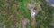 Round flight over lighthouse on rocky cape to huge lake