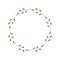 Round frame of green twigs with leaves and dots. Design template for logo, invitation, greetings. Laconic stylish wreath.
