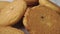 Round fresh shortbread cookies on a wooden surface close up