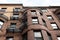 Round front of brownstone city housing, rusticated stone trim and metal balconies