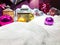 Round, glass, multi-colored balls lie on the white snow. showcase decoration. cute decorations to create a Christmas mood. the