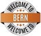 Round golden welcome to bern badge