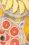 On the round grates of the fruit and vegetable drying machine, there are fresh sliced grapefruit, orange,pineapple, persimmon,