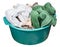 Round green plastic wash basin with dirty clothes