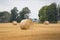 Round Hay Bales on Farmer`s Field on Prairie