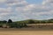 Round hay bales in a field in the British countryside being harvested Wakefield, West Yorkshire UK