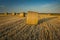 Round hay bales lying in the field