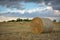 Round haystack against the sky