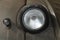 Round headlight and a turn light of a military car