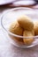 Round honey cookies in glass bowl