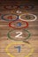 Round hopscotch numbers on wood floor