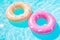 Round inflatables rubber swimming rings in pool. Generative AI