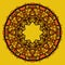Round lace patterd mandala like design in yellow