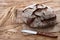 Round loaf of bread on a wooden background