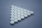 Round medicinal pills in shape of large triangle