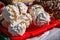 Round meringue cookies filling with condensed milk and nuts on tray