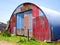 Round Metal Shed with Mismatched Paint
