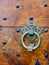 Round metallic holder on antique authentic door in Aragon, Spain. Vintage design elements