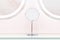 Round mirrors with illuminated reflections, modern design pastel blue and pink stylized in a beauty studio salon