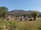 A round native huts on field and mountains