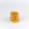 Round orange vitamins glass jar