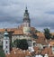 The round painted tower of the town Castle and the bell-tower of church of St. Jost, Cesky Krumlov, Czech Republic. Cesky Krumlov