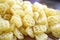 Round pasta on wooden background.