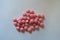 Round pink xylitol sweetened candies