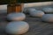 Round polished stones are placed on the tile in the evening outdoors.Holiday destination.