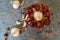 Round red chillies with garlic cloves in the red clay pot