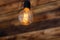 Round retro edison lamp on a wooden background