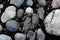 Round river rocks and a cracked stone background